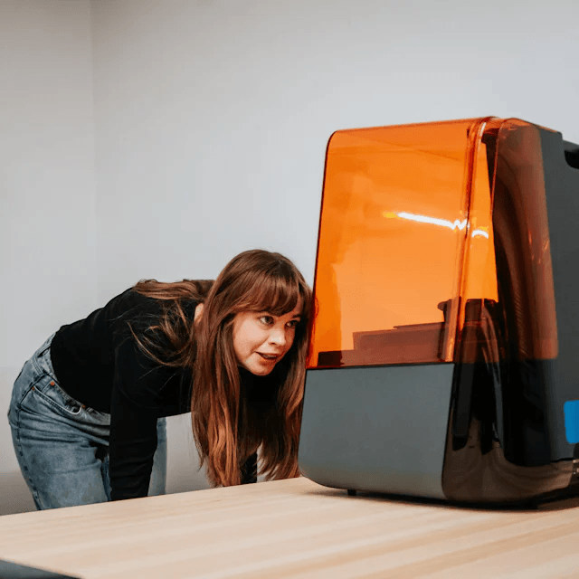 Woman looking at a machine
