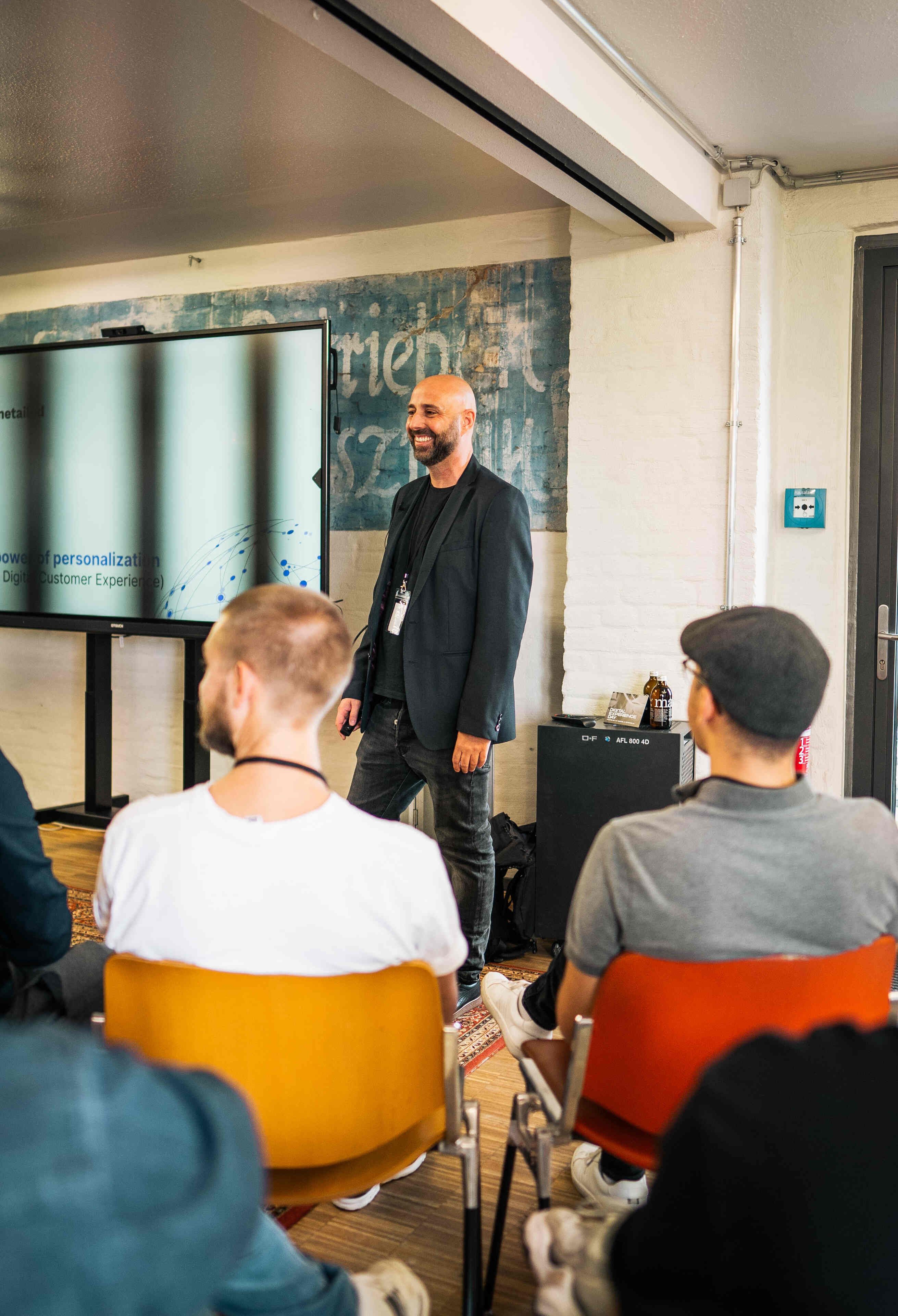Man lecturing in front of an audience