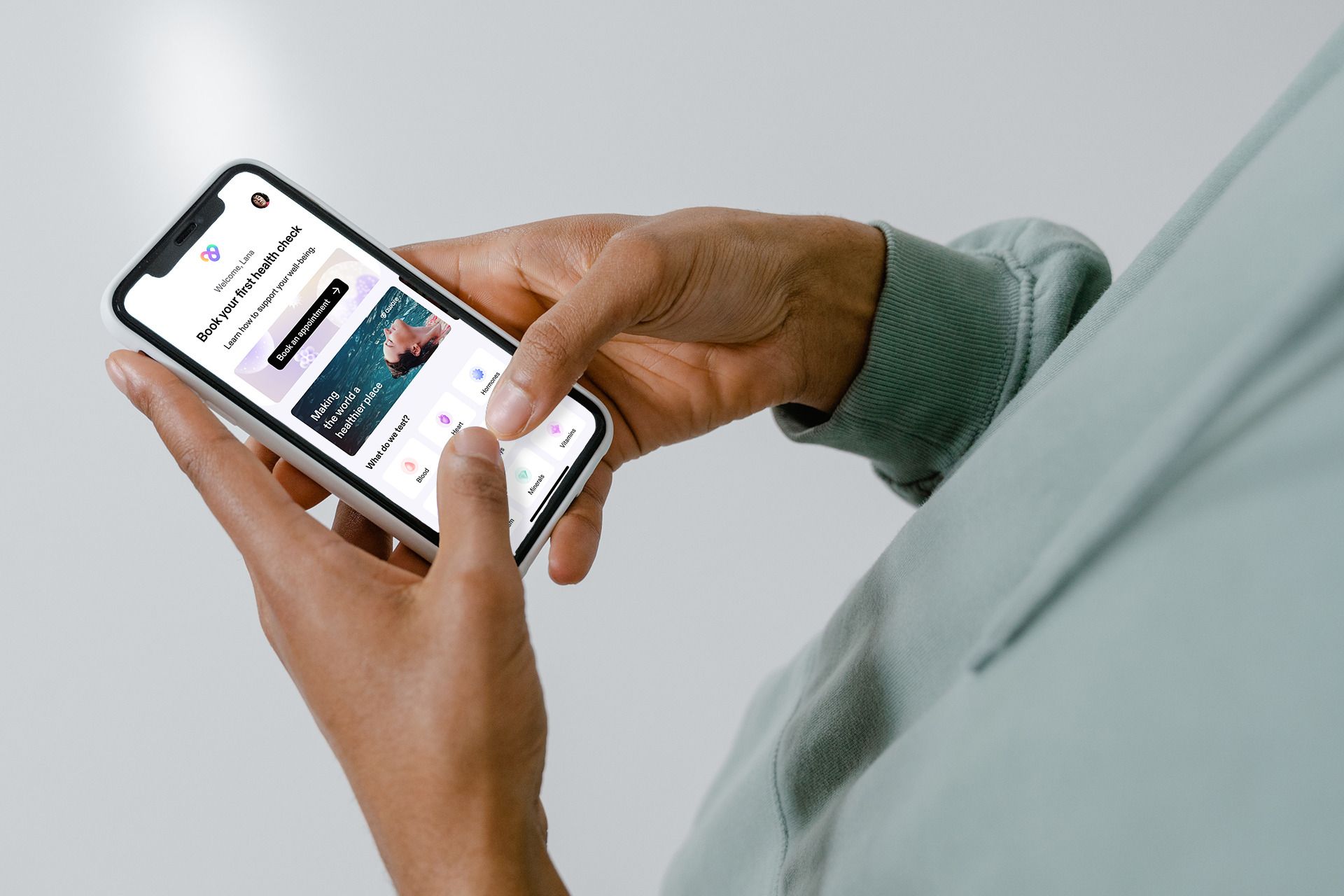 Hands holding a phone and using an application on it