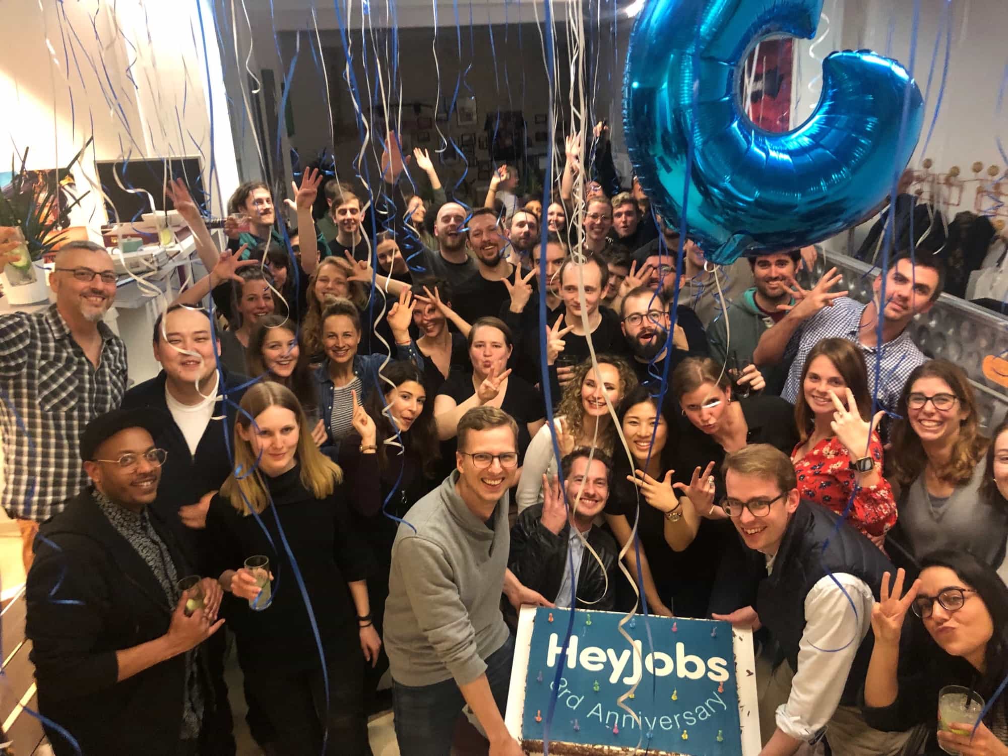 Happy group of people celebrating company anniversary